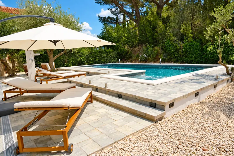 Poolside pergola and shaded seating