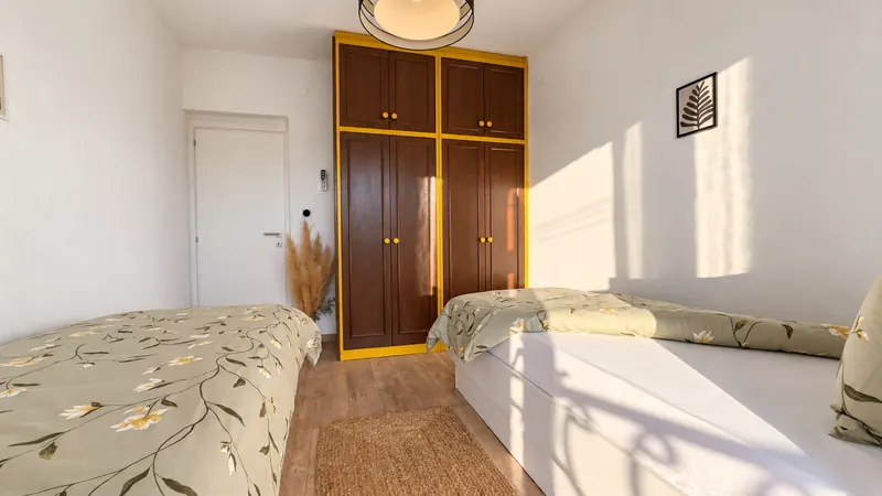 Bedroom 1 wardrobe and beds