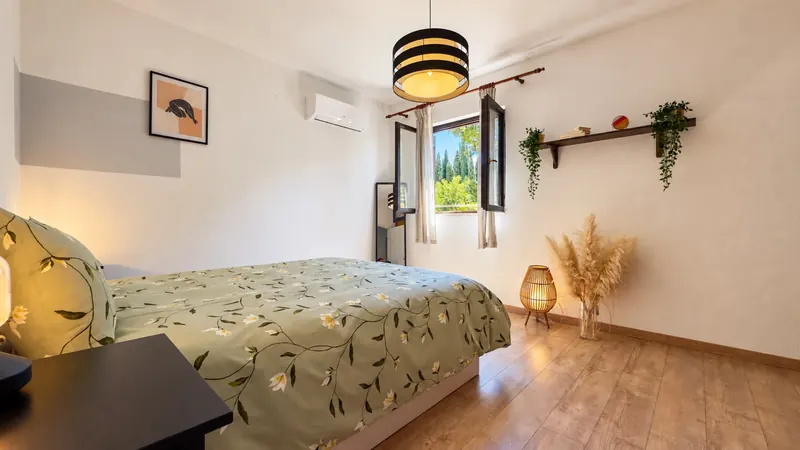 Bedroom 2 with wooden floor and window