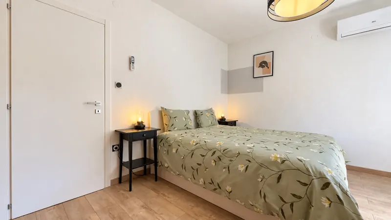 Bedroom 2 bed and bedside lighting