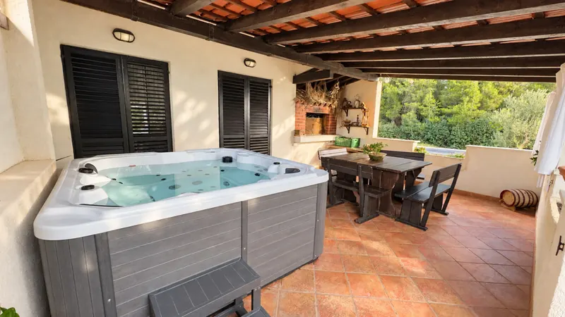 New hot tub beside the terrace dining area