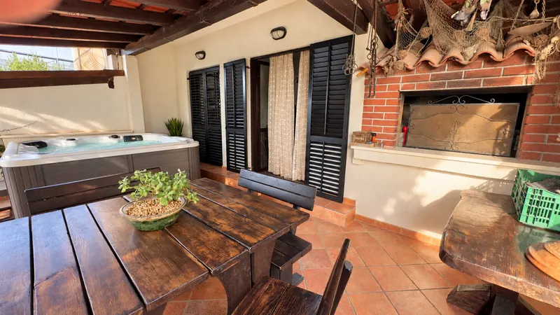 Covered terrace dining table and BBQ