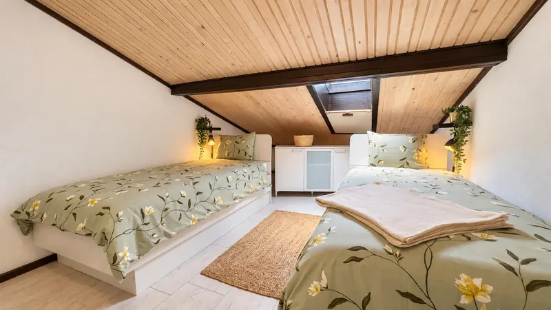Bedroom 4 beneath a timber ceiling