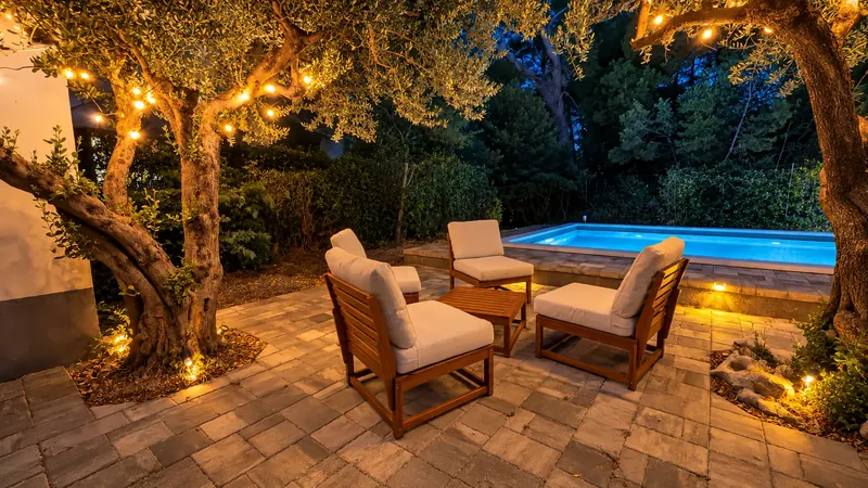 Poolside lounge seating by night